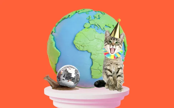 Cat and a snail on a plinth in front of a globe