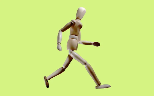 Wooden mannequin running
