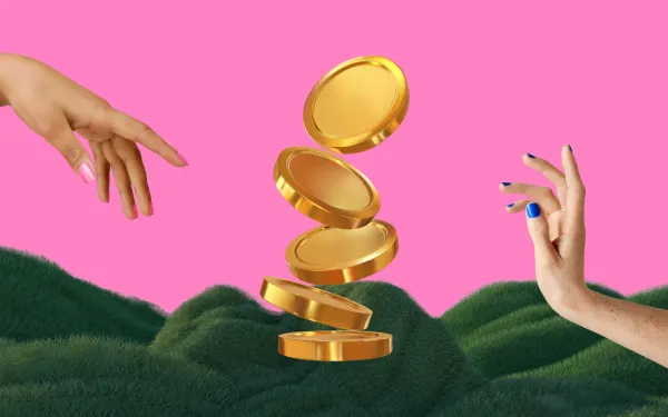 Two hands next to some giant gold coins